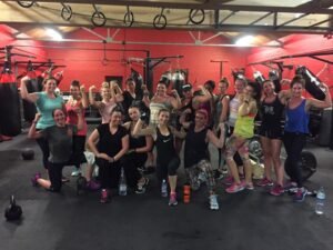 Group of women training together during an all-women’s Muay Thai class at Raptors gym, practising techniques and conditioning drills.